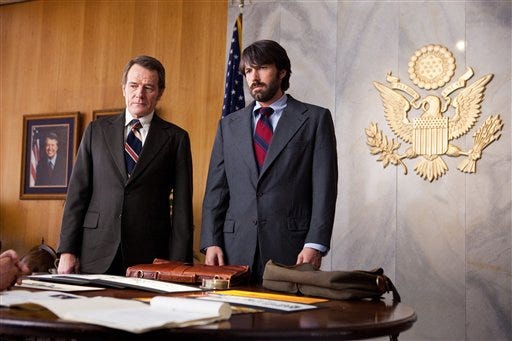 This undated publicity film image released by Warner Bros. Pictures shows Bryan Cranston, left, as Jack O'Donnell and Ben Affleck as Tony Mendez in "Argo," a rescue thriller about the 1979 Iranian hostage crisis.