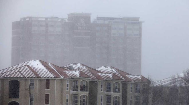 The Overton Hotel is viewed through blizzard conditions.