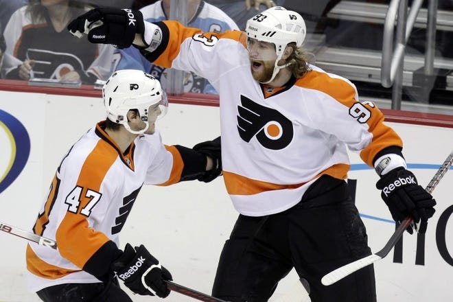 Philadelphia's Jakub Voracek (right) celebrates his first of two third-period goals with teammate Eric Wellwood on Sunday.