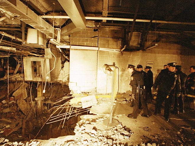 In this file photo of Feb. 27, 1993, police and firefighters inspect the bomb creater inside an underground parking garage of New York's World Trade Center the day after an explosion tore through it. Twenty years ago a group of terrorists blew up explosives under one of the towers, killing six people and ushering in an era of terrorism on American soil.