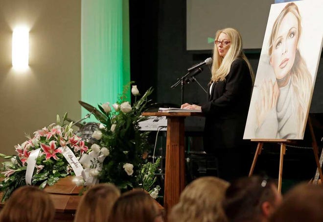 Gayle Inge, mother of country music star Mindy McCready, speaks during her daughter's funeral ceremony at the Crossroads Baptist Church in Fort Myers, Fla., on Tuesday, Feb. 26, 2013. McCready committed suicide Feb. 17 at her home in Arkansas, days after leaving a court-ordered substance abuse program. (AP Photo/Alan Diaz)