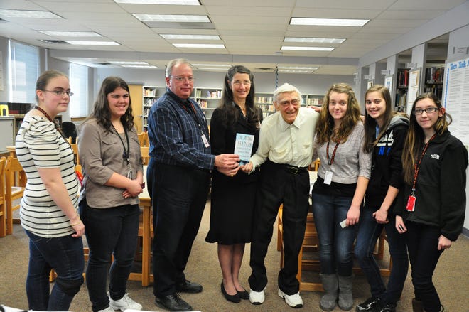 Diman Librarian Robert Rioux, Superintendent-Director Marta Montleon and Diman students join with Dr. Irving Fradkin to discuss a new biography about Fradkin’s scholarship efforts.