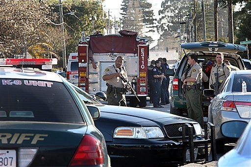 Santa Cruz County Sheriff's Deputies prepare to join officers from other agencies in securing the shooting scene near N. Branciforte Avenue and Doyle Street Tuesday, Feb. 26, 2013 in Santa Cruz, Calif., where two Santa Cruz Police Detectives were shot and killed. The shooting in the community about 60 miles south of San Francisco took place as police were investigating a report of a sexual assault, Santa Cruz County Sheriff Phil Wowak said. A suspect was shot while police were in pursuit of the shooter, the sheriff said. Authorities said that person also died. (AP Photos/Santa Cruz Sentinel, Dan Coyro)