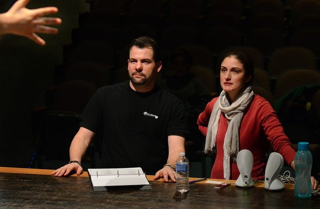 Director Scott Cooney and choreographer Lauren Gebhart, Choreographer watch the chorus rehearse the "Munchkinland" scene from "The Wizard of Oz."