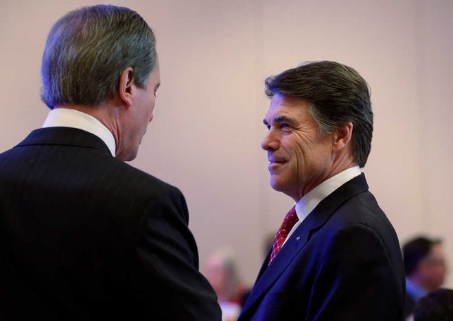 Gov. Rick Perry, right, talks Tuesday with Lt. Gov. David Dewhurst prior to his address to the Texas Business Leadership Council in Austin.