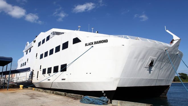 The Black Diamond casino cruise ship docked at the Port of Palm Beach .