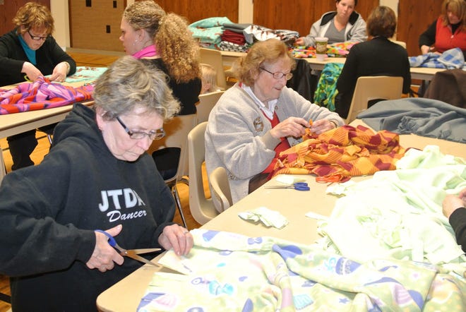 courtesy photo

Members of The Relief Society, a women's group within the local Church of Jesus Christ of Latter-day Saints, make warm fleeces for those in need.