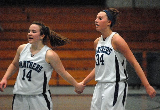 Franklin's Kristi Kirshe (left) and Alicia Kutil celebrate after the Panthers' 54-47 win over Needham in the first round of the Division 1 South sectional tournament on Wednesday night.