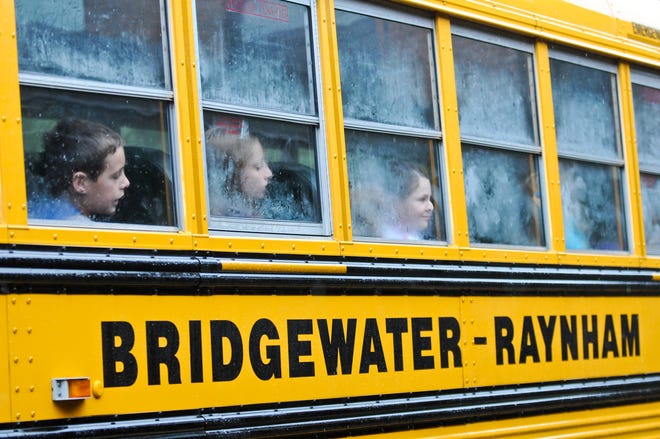 Students wait to get off the bus at LaLiberte Elementary School.