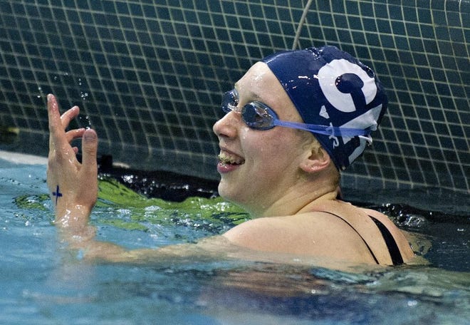 Council Rock North’s Tommie Dillione reacts to her meet-record time of 1:50.01 in the 200-yard freestyle during the District One Class AAA swimming championships at LaSalle University in Philadelphia Thursday.