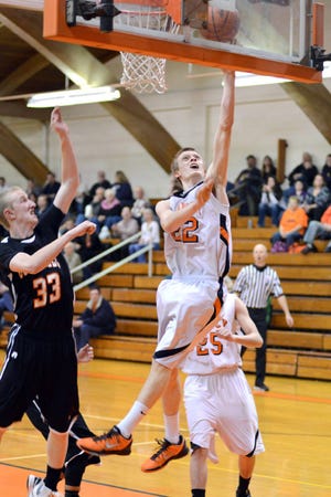 Quincy's Collin Palmer puts in two points on Thursday night. Derek Booher Photo