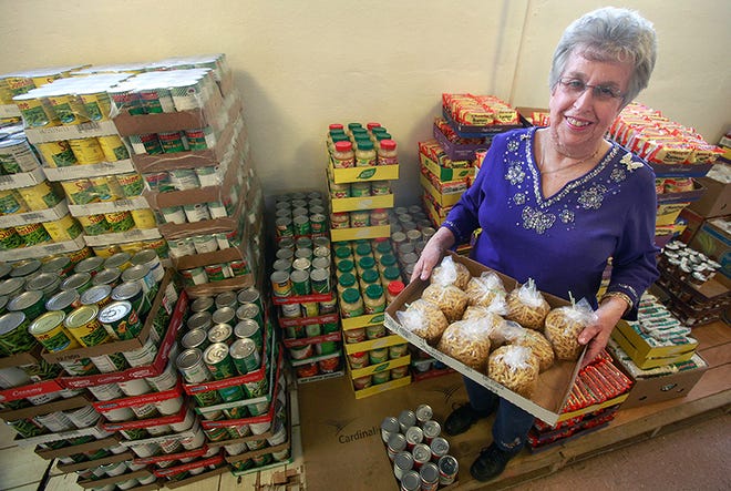 A big part of Kumler Outreach Ministries is their food pantry. Kumler volunteer of the year Shirley Pate stands for a portrait in the bulk food storage area at Kumler's offices on North Grand Ave. in Springfield on Tuesday, Jan. 8, 2012.
