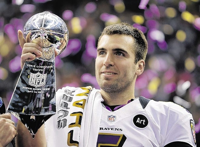 FILE - In this Feb. 13, 2013 file photo, Baltimore Ravens quarterback Joe Flacco (5) holds the Vince Lombardi Trophy after defeating the San Francisco 49ers 34-31 in the NFL Super Bowl XLVII football game in New Orleans. The Ravens will have to pay at least $14.896 million for Flacco to be their quarterback in 2013. The NFL set the franchise tag at that figure Friday, March 1, 2013, and if the Ravens can't reach agreement on a long-term deal with Flacco before free agency begins March 12, they could tag him. (AP Photo/Matt Slocum, FIle)