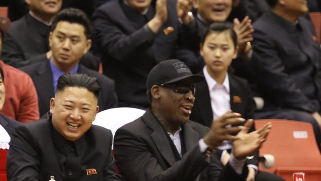 North Korean leader Kim Jong Un, left, and former NBA star Dennis Rodman watch North Korean and U.S. players in an exhibition basketball game at an arena in Pyongyang, North Korea, Thursday.