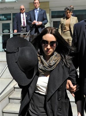 Casey Anthony leaves the federal courthouse in Tampa Monday, after a bankruptcy hearing. Anthony, 26, has not made any public appearances since she left jail after being acquitted in the murder of her two-year-old daughter Caylee. She filed for bankruptcy in Florida in late January, claiming about $1,000 in assets and $792,000 in liabilities. Court papers list Anthony as unemployed, with no recent income.