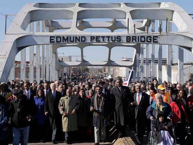 Vice President Joe Biden leads a group across the Edmund Pettus Bridge in Selma on Sunday. They were commemorating the 48th anniversary of Bloody Sunday, when police officers beat marchers as they tried to cross the bridge from Selma to Montgomery.