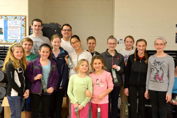 Twelve team members from Dolphins Swim Team at Central Bucks Family YMCA competed in the recent Charlie Hartley Memorial Silver Championship in Sewell, NJ. Participating athletes included: (Left to right) Katelyn Beasley, Connor Martin, Lucas Dyke, Hanna Kerest, Christine Bebbington, Coach Nick Barlow, Yulim Kim, Alaina Martin, Sydney Robinson, Chantel Van Dongeren, Kaitie Button, Brooklyn Wiley, Maddie Corona, Elizabeth Axler. CONTRIBUTED PHOTO