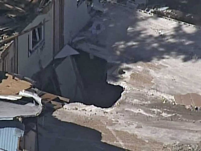 In this video image provided by ABC Action News-WFTS TV shows an aerial photo of a sinkhole Monday in Seffner, Fla. The hole opened up underneath a bedroom late Thursday evening and swallowed Jeffrey Bush.