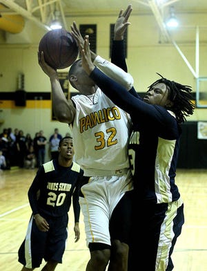 Pamlico's Josiah Simmons powers to the rim in a game earlier this season. Simmons averages 12 points per game and will be relied upon by the Hurricanes against East Carteret.