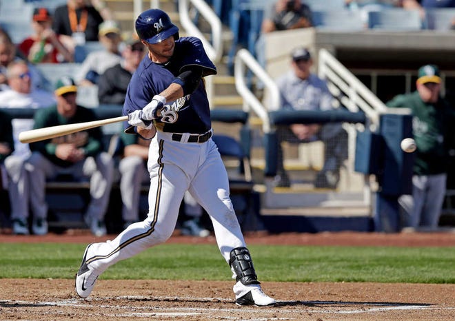 Milwaukee Brewers' Ryan Braun hits a home run during the first inning of an exhibition spring training baseball game against the Oakland Athletics Saturday, Feb. 23, 2013, in Phoenix. (AP Photo/Morry Gash)
