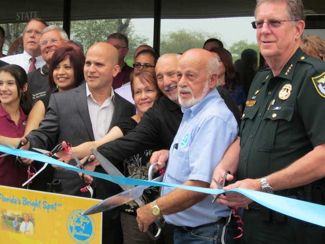 State Rep. David Santiago had a grand opening last week at his office in the Fountains Plaza, 777 Deltona Blvd. in Deltona and is open for residents with concerns about state government. Pictured from left are: daughter, Gabriella Santiago, wife, Emma Santiago, Rep. David Santiago, his mother and father Norma and Bienvenido Santiago, Deltona Mayor John Masiarczyk and Volusia County Sheriff Ben Johnson.