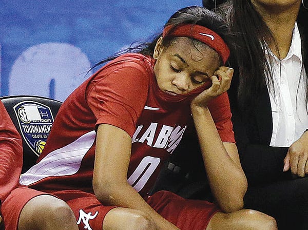 Alabama guard Daisha Simmons sits on the bench late in the Tide’s loss Thursday.
(John Bazemore | Associated Press)