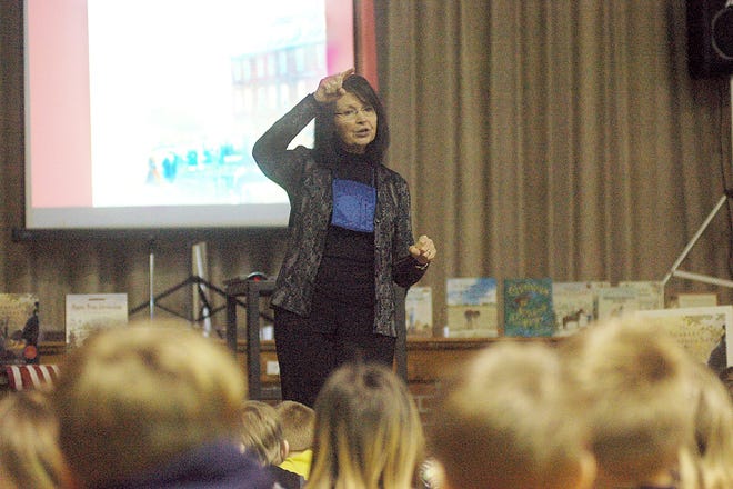 Author Trinka Hakes Noble talks with fourth-graders at Bailey Elementary School about her book, "The Scarlet Stocking Spy." Hakes, originally from Jonesville, lives in New Jersey. She was at the school Thursday to talk with fourth- and fifth-graders. She also spoke during Family Fun Night.