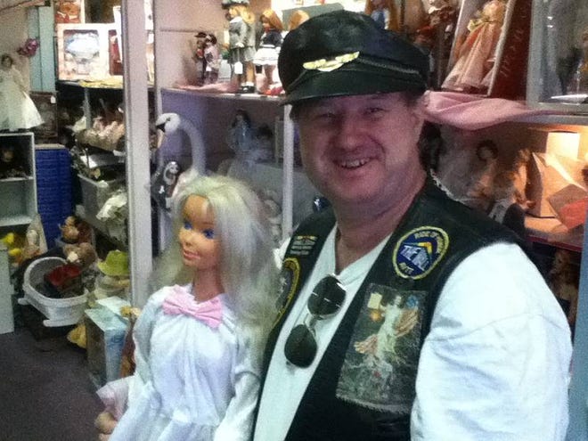 Albert Pendergraff stops in at the Dolls of DeLand shop on Woodland Boulevard during the town's annual Bike Rally on Saturday, March 9, 2013. knew his dolls. Pendergraff knows dolls. He has 450 porcelain ones at home, plus 200-plus Barbies, and collector's dolls ranging from Evel Knievel to the Kennedys to Marilyn Monroe to Elvis to every original Star Trek character but one. (Pavel Chekov — he's still searching for that one.)