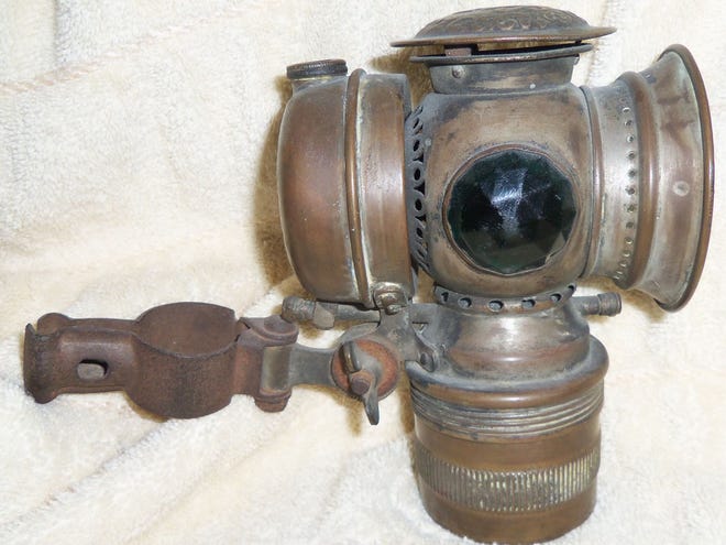 This antique carbide-type bicycle lamp also was used on automobiles. (Courtesy of John Sikorski)