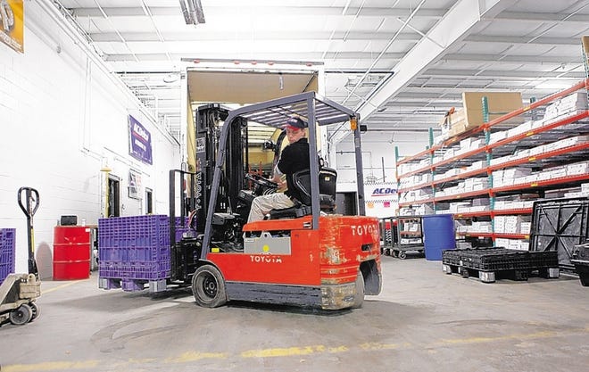 Archie Gallinger of United Auto Supply drives a forklift in the company's new 32,000-square-foot warehouse in the Town of Newburgh. The upstate New York auto-parts distributor had been considering moving to the mid- to lower-Hudson Valley for several years.