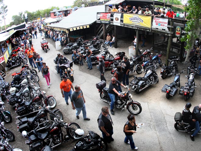 Bikers pour into the Iron Horse Saloon as Bike Week rolls on Monday afternoon along U.S. 1. Bike Week continues through Sunday through the area.
