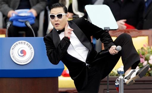FILE - In this Feb. 25, 2013 file photo, South Korean rapper PSY performs before President Park Geun-hye's presidential inauguration ceremony at the National Assembly in Seoul, South Korea. (AP Photo/Lee Jin-man, FIle)