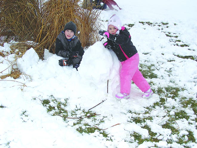 The snowman made by William Schaeffer, 7, and his sister Elica, 3, was toppled by mid-afternoon.