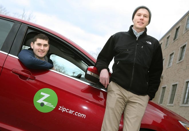 Salve Regina University sophomore Christopher LeCours, left, and Kevin McDonald, an area coordinator for the university’s Office of Campus Life, say two Zipcars on campus are getting frequent use.