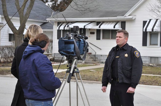 Pontiac Police Major Dan Davis talks to Peoria media in front of the Pontiac home where an elderly woman was stabbed Tuesday.