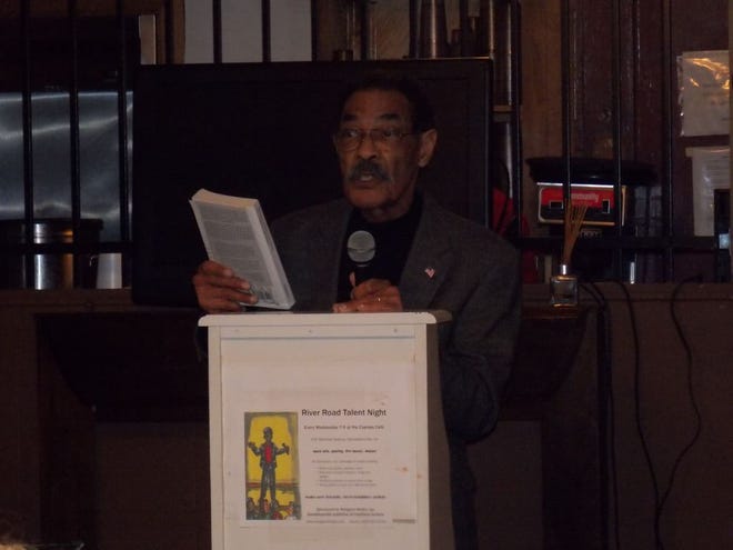 Author Curtis Johnson shares some segments from his book, “Glimpses of Black Life along Bayou Lafourche” at the Cypress Café last Wednesday at the weekly Talent Night.