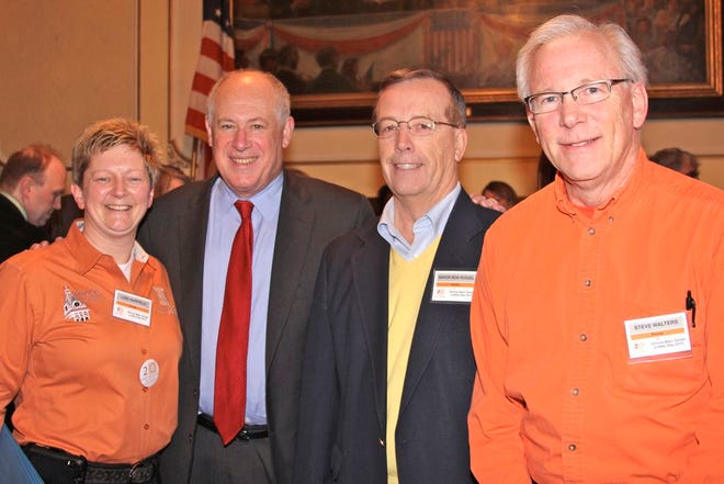 P.R.O.U.D. executive director Lori Fairfield, stands with Gov. Pat Quinn, Mayor Robert Russell, and Steve Walters when the local group learned Pontiac was chosen to host an upcoming state event.
