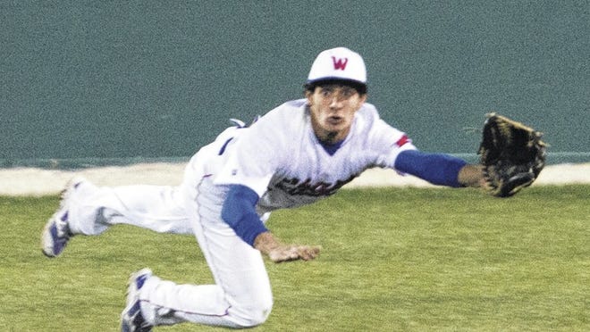Alex Cabezas dives for a fly ball in center field against Bowie at Westlake March 5.