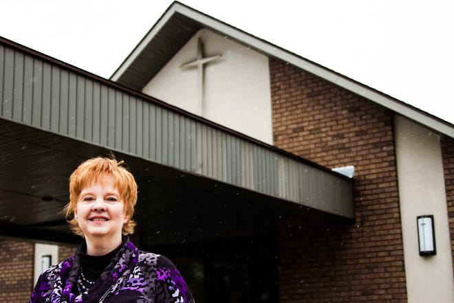 Senior pastor Karen Lavrack stands outside New Life Nazarene Church's new building located on 132nd Street in Holland. Lavrack moved to Holland with her husband after praying and asking themselves 'What can we do for the kingdom if money was no issue?' Kelly Gampel/Sentinel Staff
