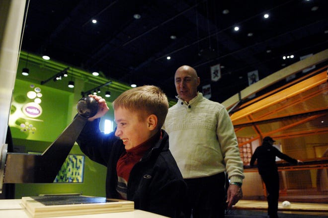 Connor Wolverton, 6, of Peoria tests his arm strength at the IHSA Peak Performance exhibit at the Peoria Riverfront Museum. Visitors can test their sports skills in a variety of interactive stations.