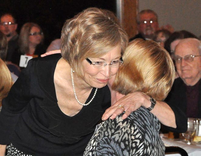 Denise Pettit, who along with her husband, Dr. Reid Pettit, were named Business Persons of the Year, shares an embrace from Kelly Eckhoff, the Volunteer of the Year.