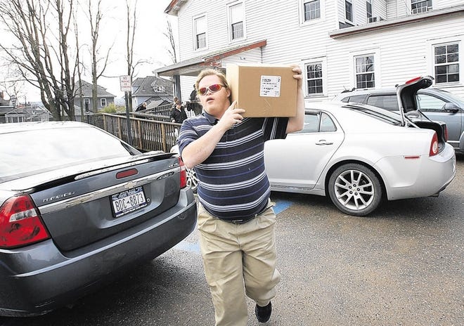 Meals On Wheels volunteer Marc Salinas, who is from the Orange AHRC, carries a box to a waiting minivan as he prepares for delivery at the Meals On Wheels facility in Port Jervis, NY, on Thursday, February 28, 2013.
Dawn J. Benko for the Gazette