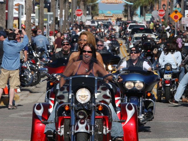 A pair of lady bikers ride a three-wheel east on Main Street in Daytona Beach as Bike Week 2013 roars on into the weekend. Bike Week has proven to be a valuable niche for some businesswomen in Volusia County.