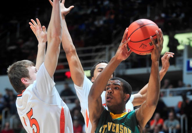 Stevenson's Connor Cashaw looks for an open pass on Friday in the IHSA Class 4A semifinal game against Edwardsville at Carver Arena. Stevenson leads 30-20 at the half.