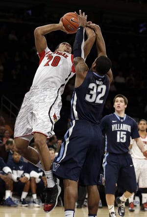 AP Photo/Frank Franklin II - Louisville's Wayne Blackshear (20) shoots over Villanova's James Bell (32) during the first half of an NCAA college basketball game at the Big East Conference tournament in New York on March 14.