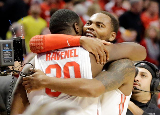 Ohio State forward Evan Ravenel (30) and Ohio State forward Deshaun Thomas celebrate after an NCAA college basketball game against the Wisconsin in the championship of the Big Ten tournament Sunday, March 17, 2013, in Chicago. Ohio State won 50-43. (AP Photo/Nam Y. Huh)