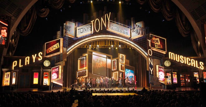 FILE - In this June 7, 2009 file photo, actors perform a segment from the show Guys and Dolls at the 63rd annual Tony Awards in New York. The Broadway League and the American Theatre Wing, joint producers of the Tony Awards show, said that the glittery event will be broadcast live from Radio City Music Hall this year. Producers of the show were forced to find a new home for the 2011 event after Cirque du Soleil moved into the 6,000-seat Rockefeller Center arena with its $50 million acrobatic rock opera "Zarkana." The Tonys had been hosted at Radio City since 1997. For the past two years, the Tonys were handed out at the Beacon Theater on Manhattan's Upper West Side. The venue was much smaller, having only about 2,870 seats, leading to ticket-rationing.
