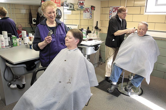 INDEPENDENT KEVIN WHITLOCK
n Ralph Miller and his wife Connie Miller cut hair in their home barber shop/beauty salon in Tuscarawas Township. Connie works on ten year customer Lynda Brugh while Ralph cuts thirteen year customer Bob Stuck's hair.