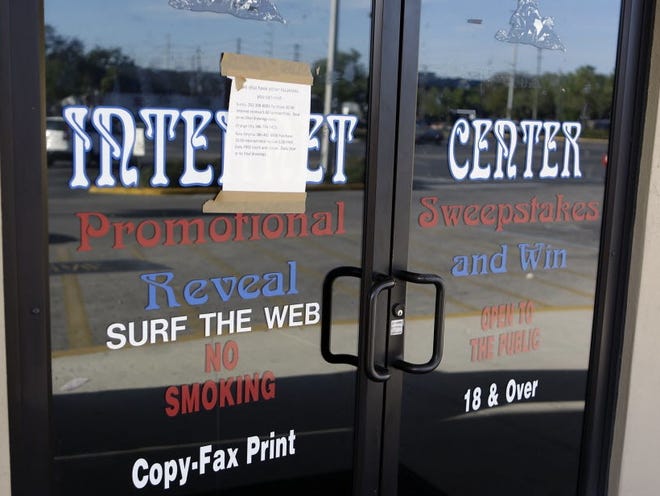 In this file photo, the entrance to a closed down and vacant Internet Cafe run by Allied Veterans is seen Wednesday, March 13, 2013, in Casselberry, Fla.