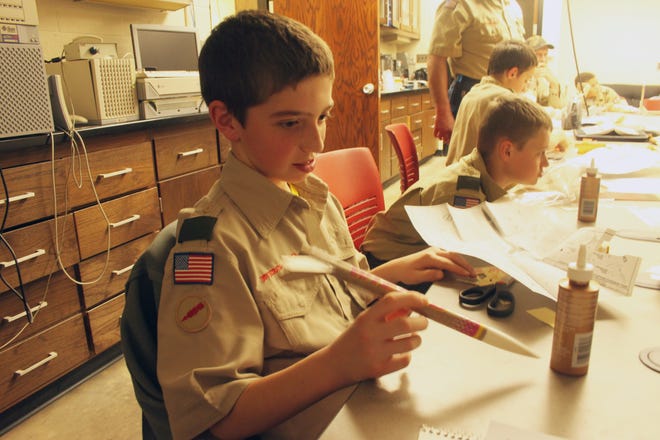 Boy Scout Kevin Hill, 11, of Davenport, Iowa, earned his first merit badge in space exploration Saturday at Monmouth College's Merit Badge University event.